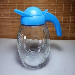 Solmaz Mercan Glass Juice Pitcher with Blue Lid Embossed Fruit Pattern Vintage